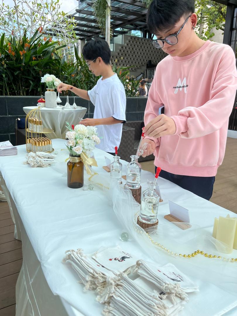 Guest blending perfume at the SIDDHAM wedding perfume bar